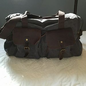 Large duffle bag with leather pockets
